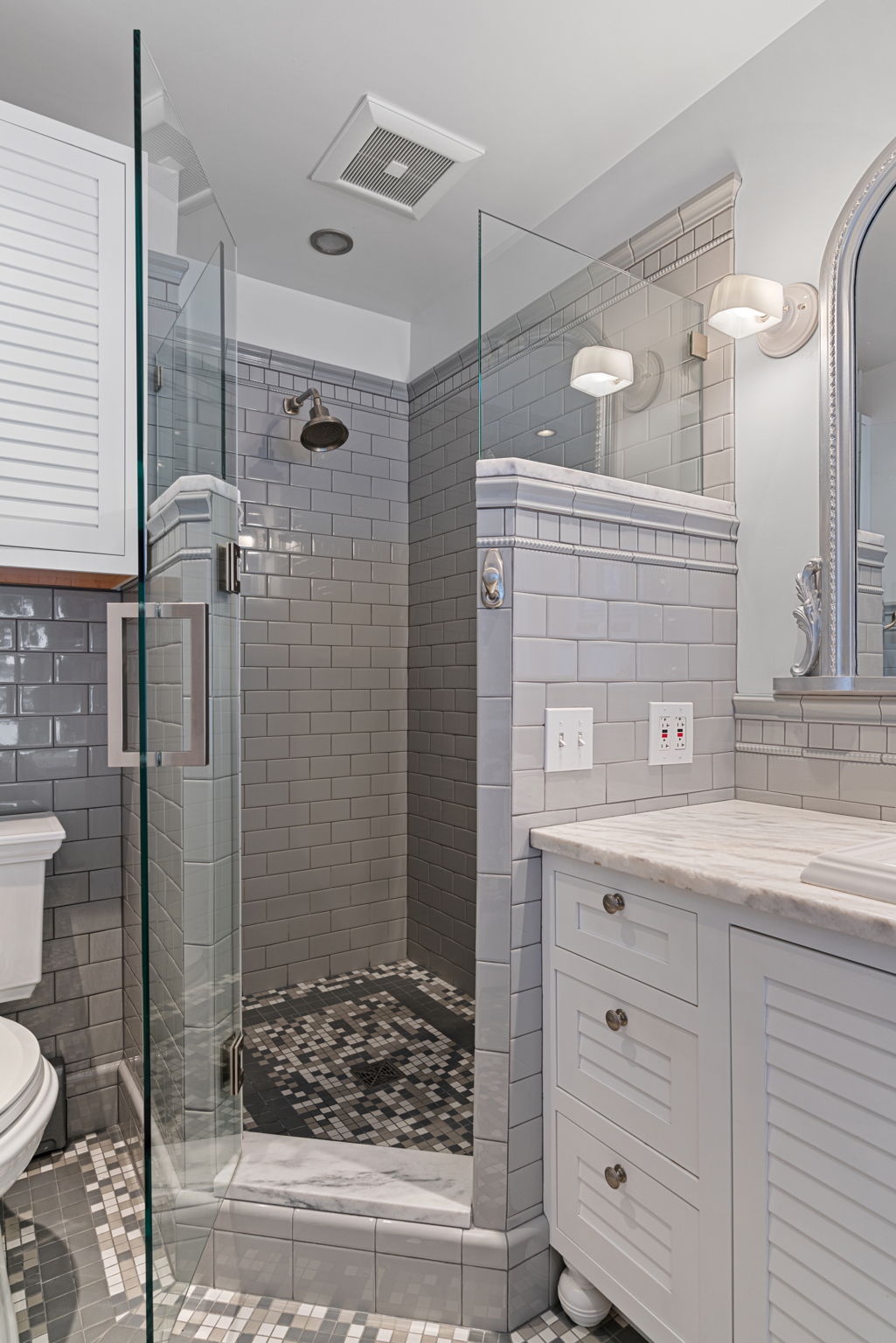 Renovated bathroom featuring a luxurious walk-in shower.