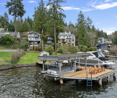 Dive into lake life with this captivating waterfront home boasting 35' of private shoreline & dock.