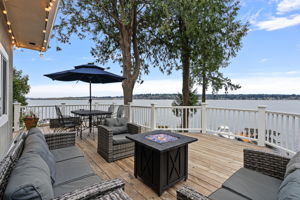 Entertain on this expansive deck overlooking the sparkling lake.