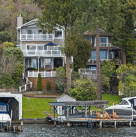 Enjoy the feeling of being on vacation every day with your own private dock and covered boat moorage.