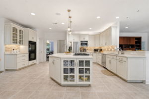 Chef's Gourmet Kitchen with Ample Cabinetry & Breakfast Bar
