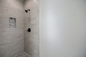Primary Bathroom:  Glass shower door is on order!