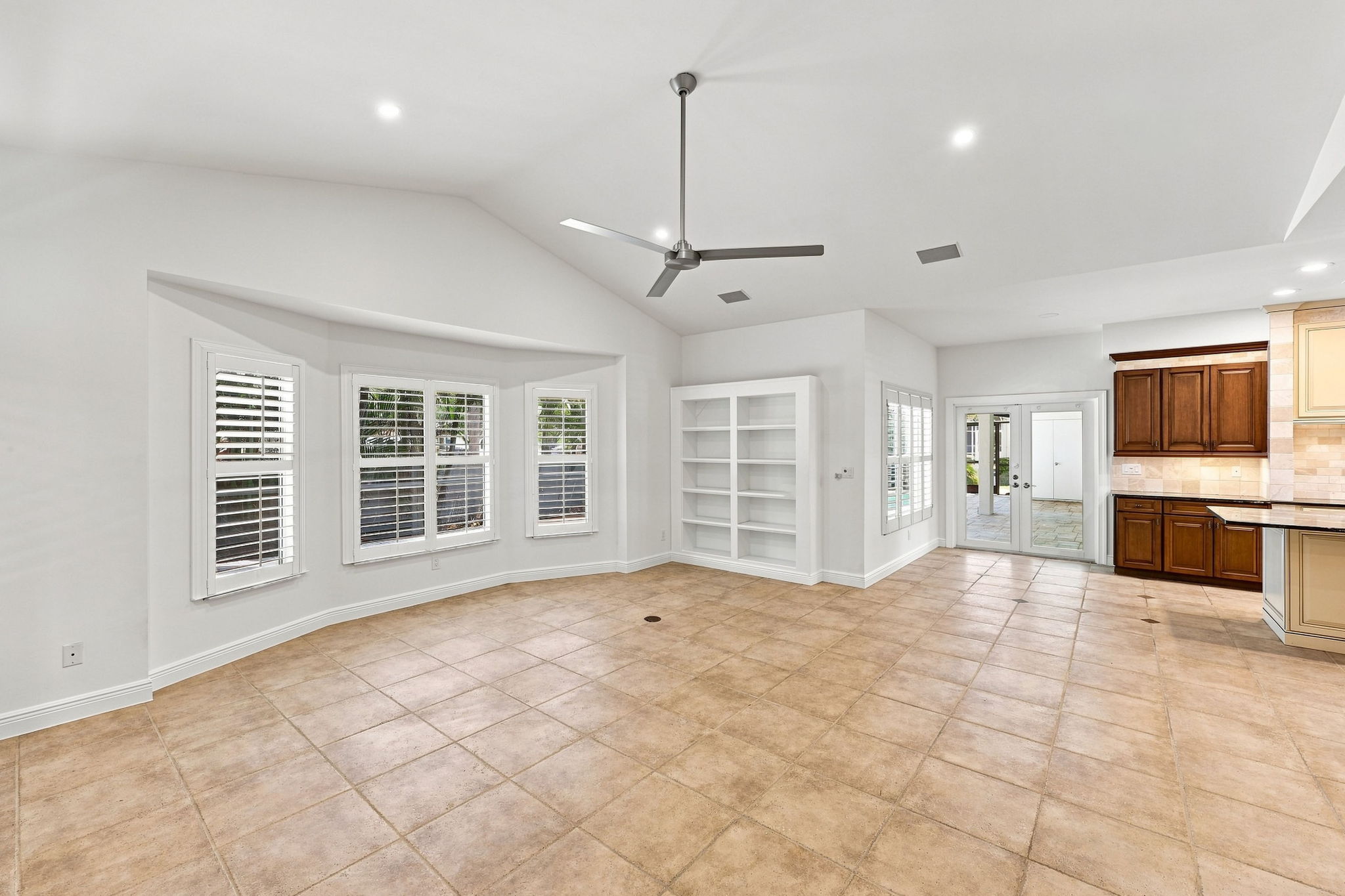 large family room with LED lighting and built in book shelf