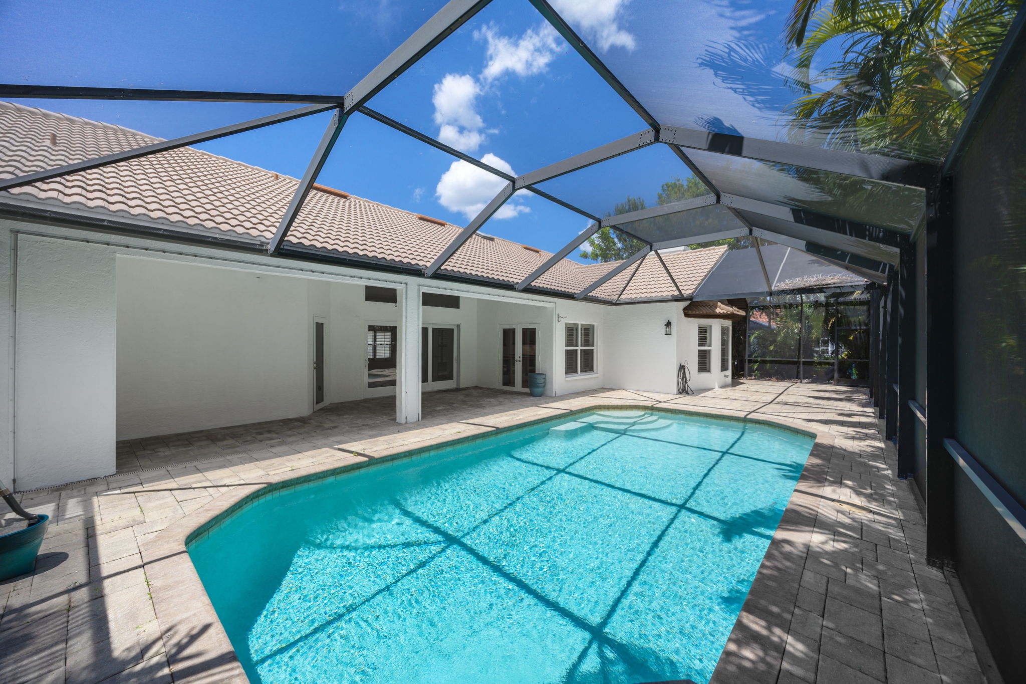 Covered outdoor living next to the pool