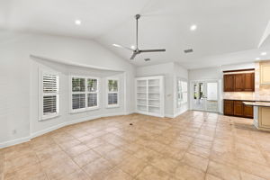 large family room with LED lighting and built in book shelf