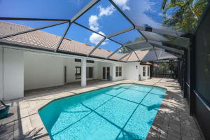 Covered outdoor living next to the pool