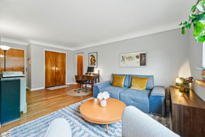 Open and spacious floorplan provides room for a sitting area and workspace.