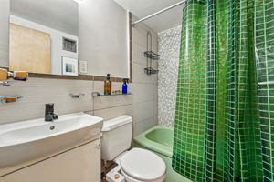 Thoughtfully updated bathroom retains some of its vintage charm.