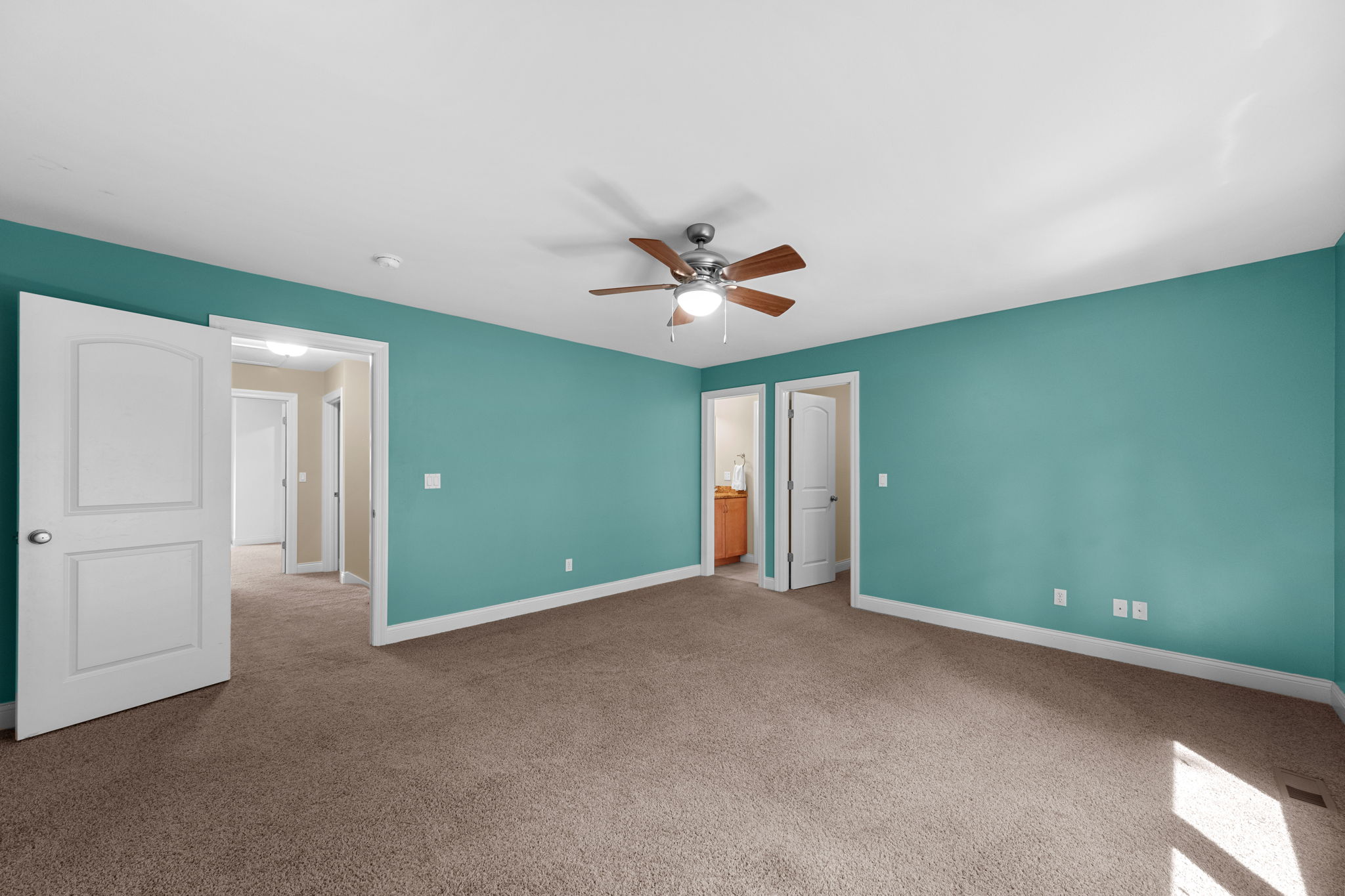 Bedroom 3 sparkles in Tiffany Blue with a walk-in closet, and jack-and-jill bath access with a private sink.