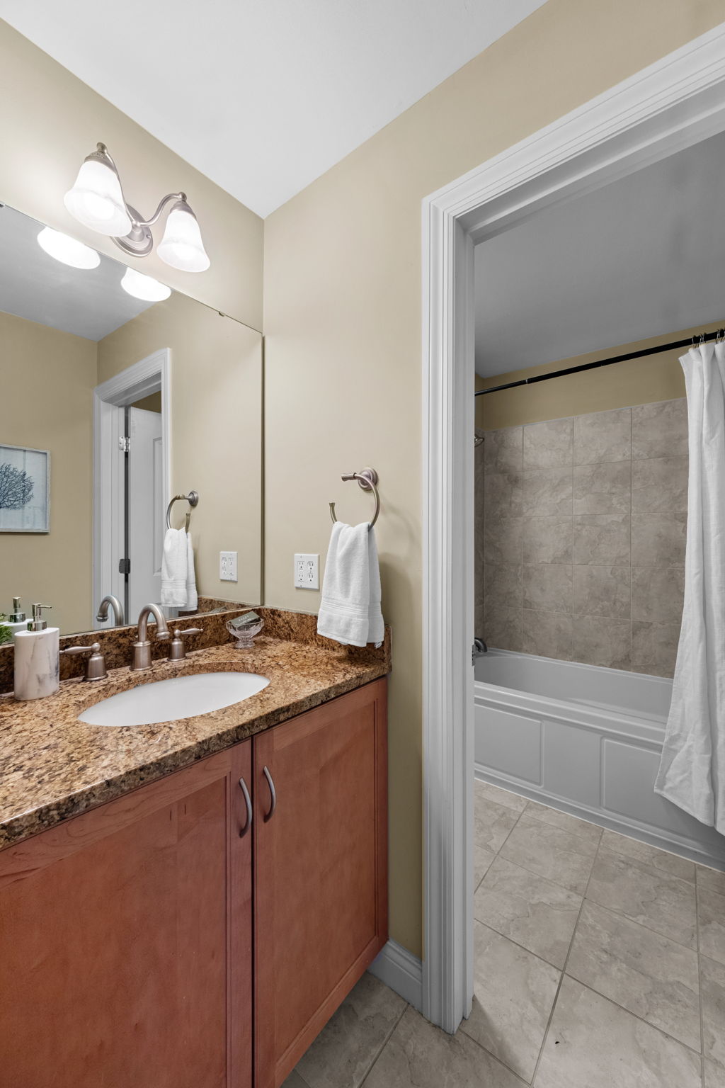 The upstairs was masterfully designed with a family in mind, as even with jack-and-jill access? Each bedroom has a private vanity.