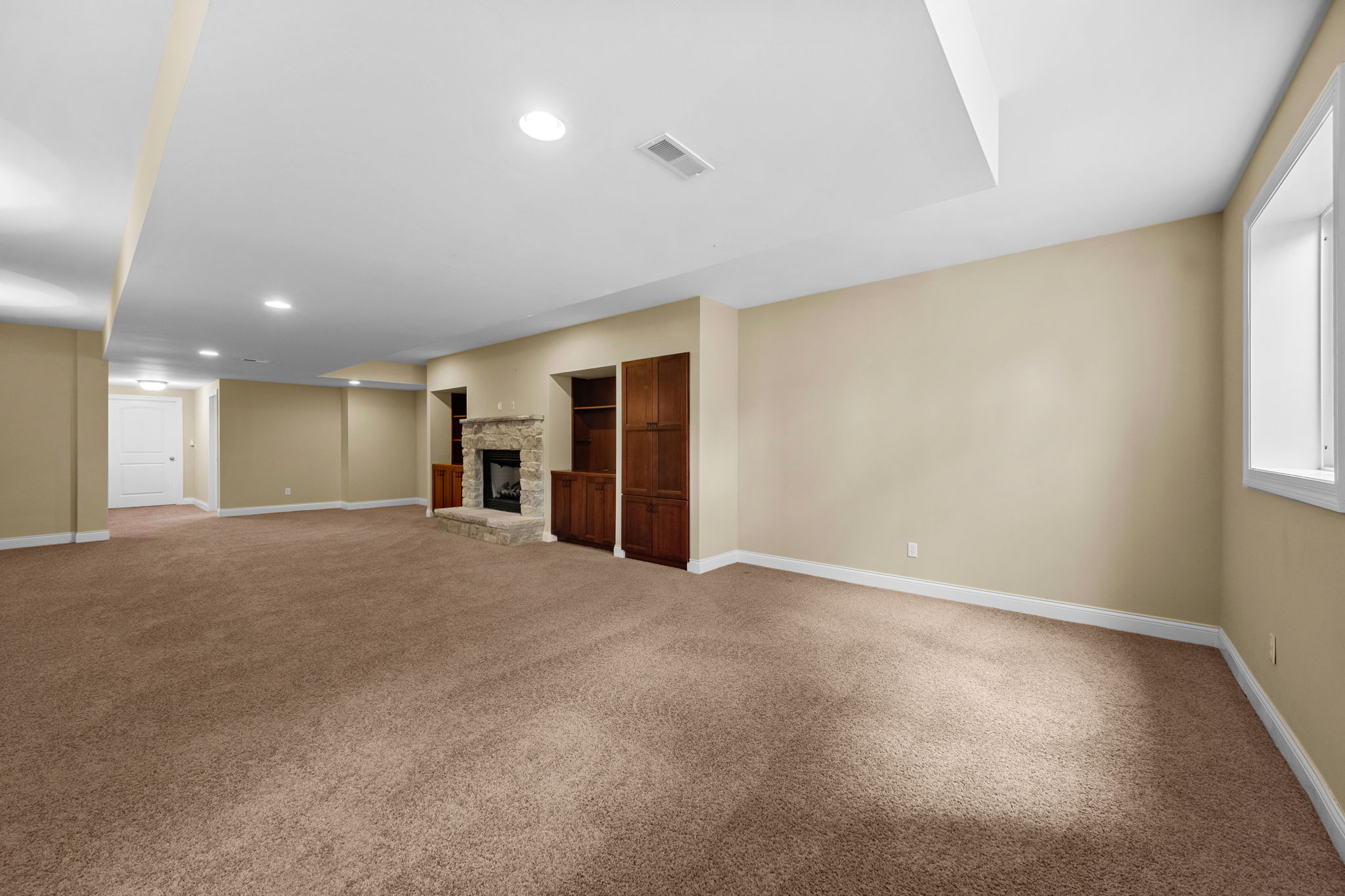 This room is ideal for slumber parties over movie nights with built-ins and a cozy gas fireplace.