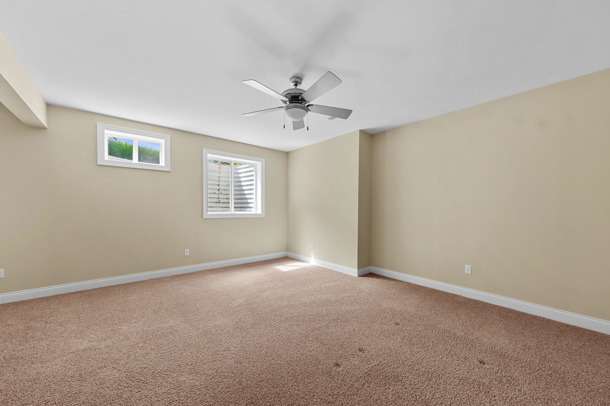 Bedroom 5 is a sizable 18x15 with natural light galore, including an egress window for safety.