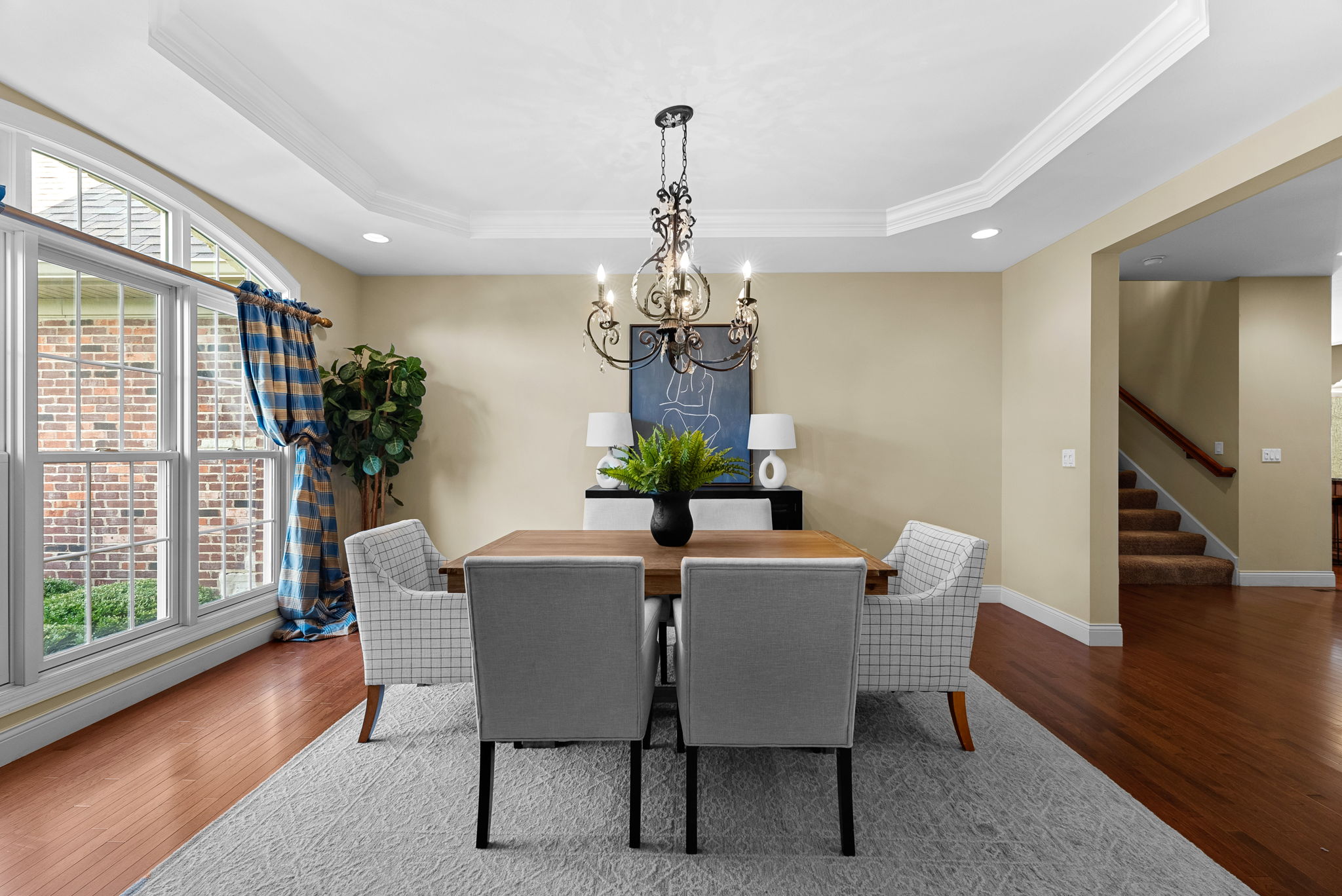 The gracious formal dining room boasts glorious natural light and room for your largest holiday gatherings!