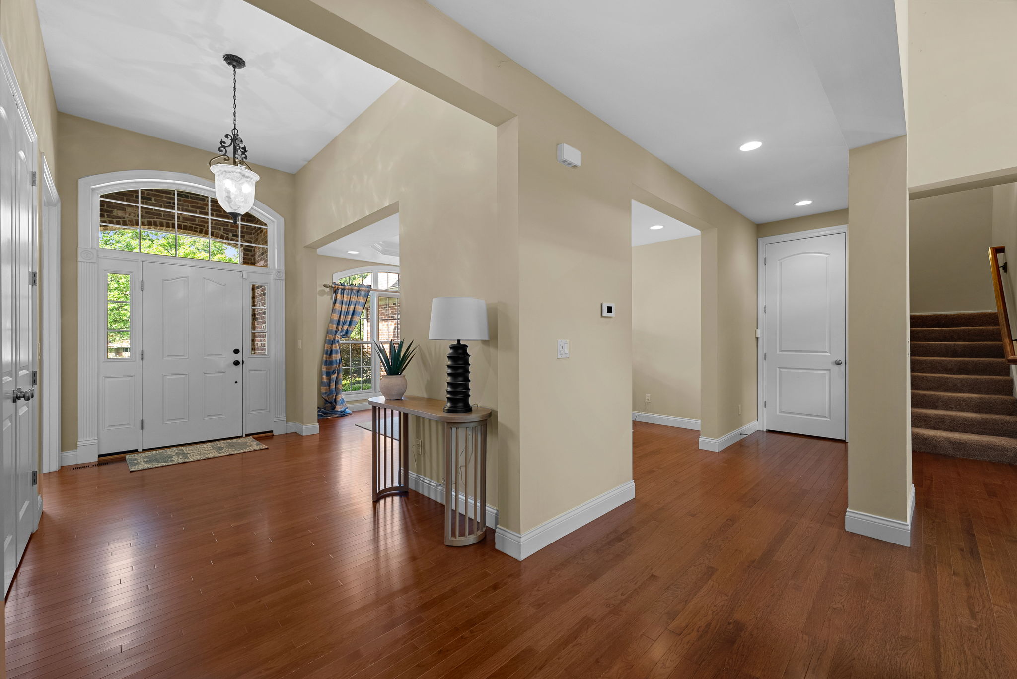 The main floor boasts a light-filled open floor plan ideal for entertaining with lovely architectural details from soaring ceilings and built-ins to custom millwork.