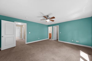 Bedroom 3 sparkles in Tiffany Blue with a walk-in closet, and jack-and-jill bath access with a private sink.