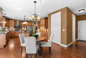 Down the hall to your right is the mudroom/laundry, another 1/2 bath, and access to the garage making shopping easy.