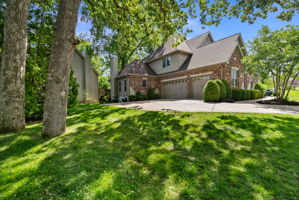 Not every .5 acre lot is equal. This one is beautifully appointed. Garage entry side of the home.