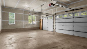 The Seller had the floor of the 3 car garage epoxy-sealed. The side entry and oversized driveway will make Winters a breeze.