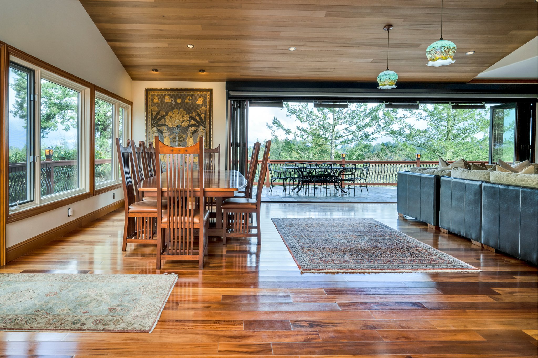 Telescoping walls of glass open to the deck with views of Mt St Helena