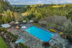 Pool area, spa, and outdoor kitchen and an outside full bath here too!