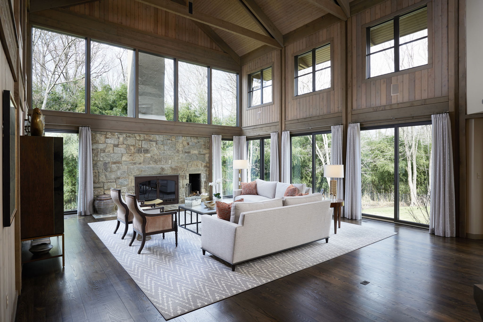 Two-Story Living Room Surrounded by Glass