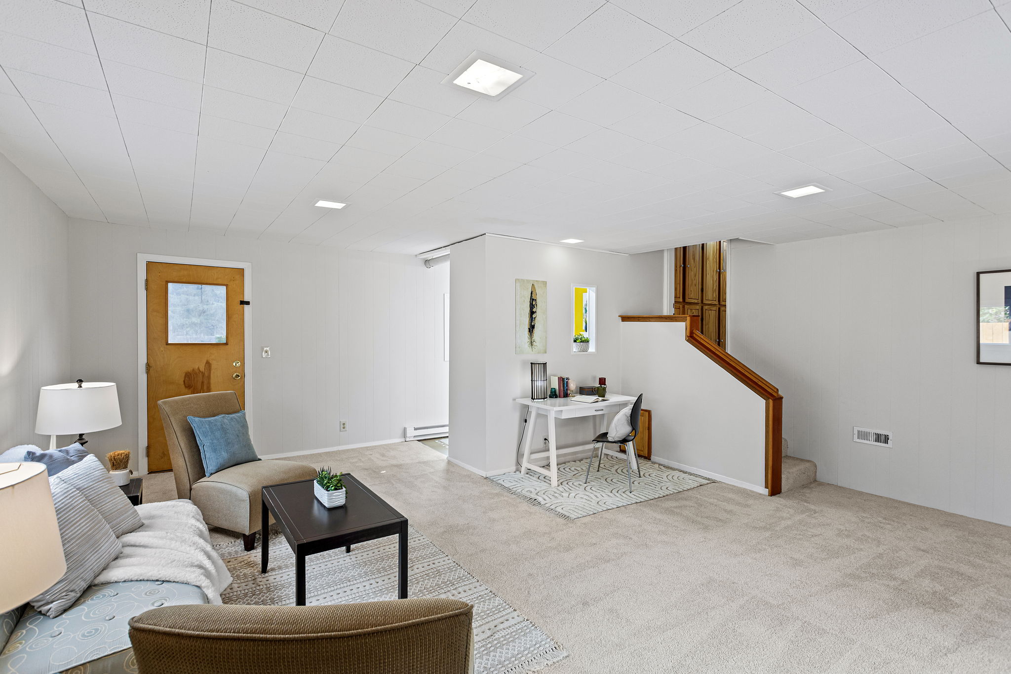 A wide-angle view of the flex room shows just how expansive this lower level is. It's roomy enough for multiple zones—movie nights, reading nooks, hobbies, or even workout space—all without disturbing the main floor above.