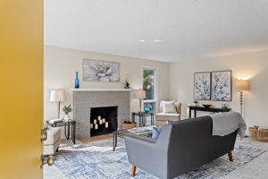 Step inside to a surprisingly spacious living room—calm tones, new carpet, and wide sightlines.