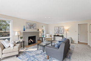 Freshly painted brick fireplace adds texture and character, even if not currently functional.