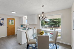 Bright and inviting, the dining area welcomes morning sun and frames the front yard through a wide east-facing window.
