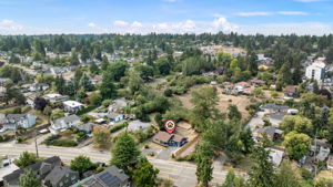 A central, tucked-in location with mature trees, privacy, and a surprisingly spacious lot—right in the heart of it all.