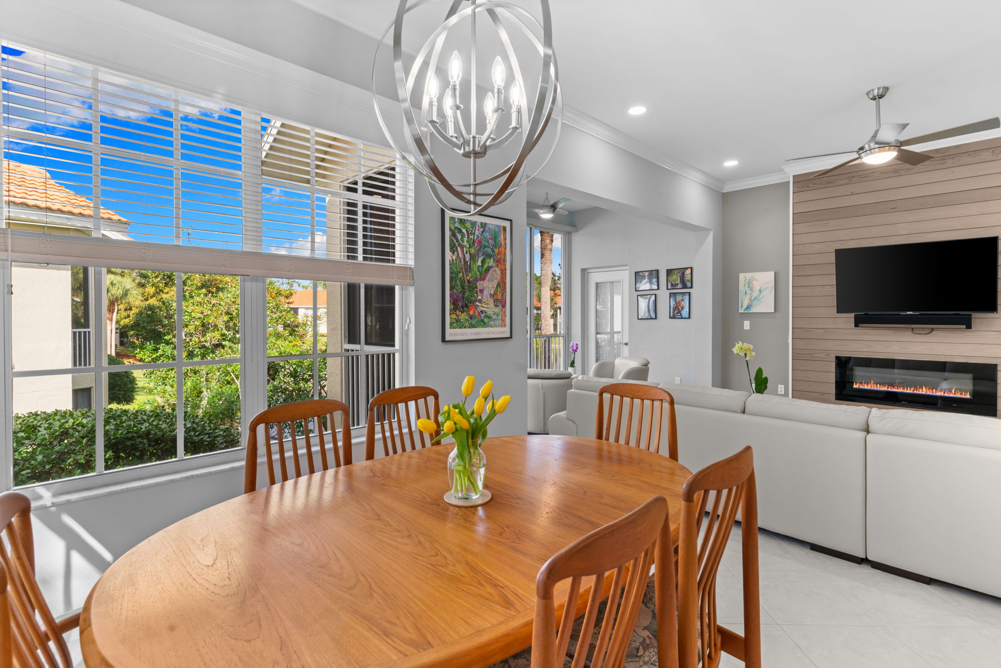 Sun-filled dining area surrounded by windows