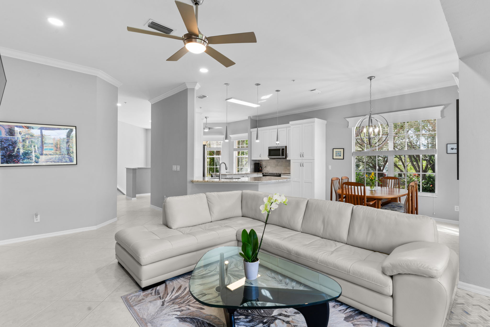 Open layout connecting living, dining, and kitchen areas