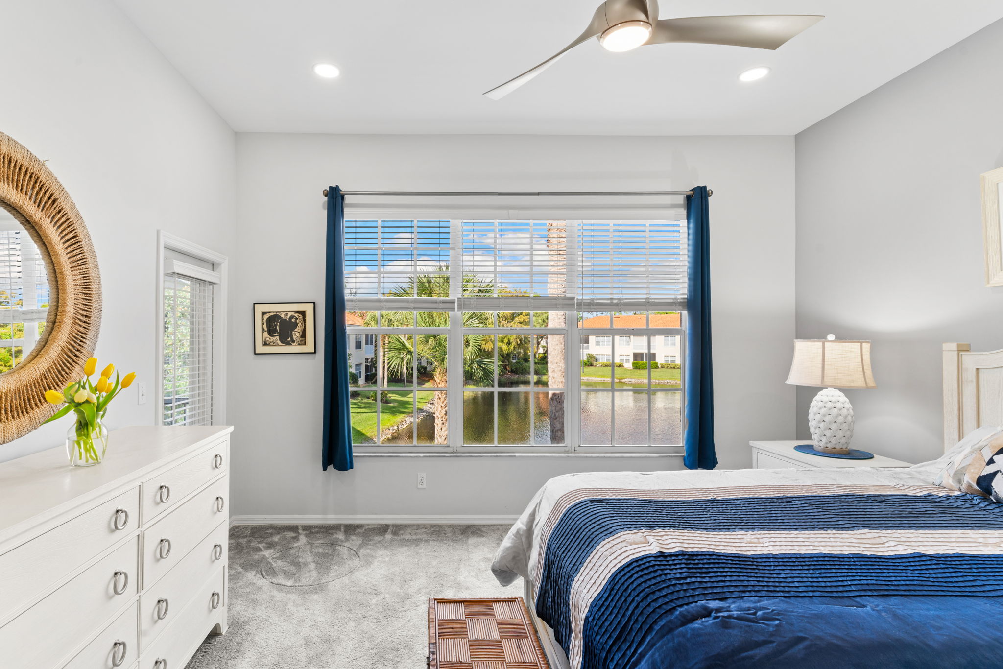 Light-filled primary suite with calming lake outlook