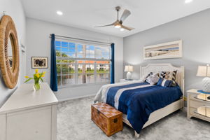 Peaceful primary bedroom with tranquil views.