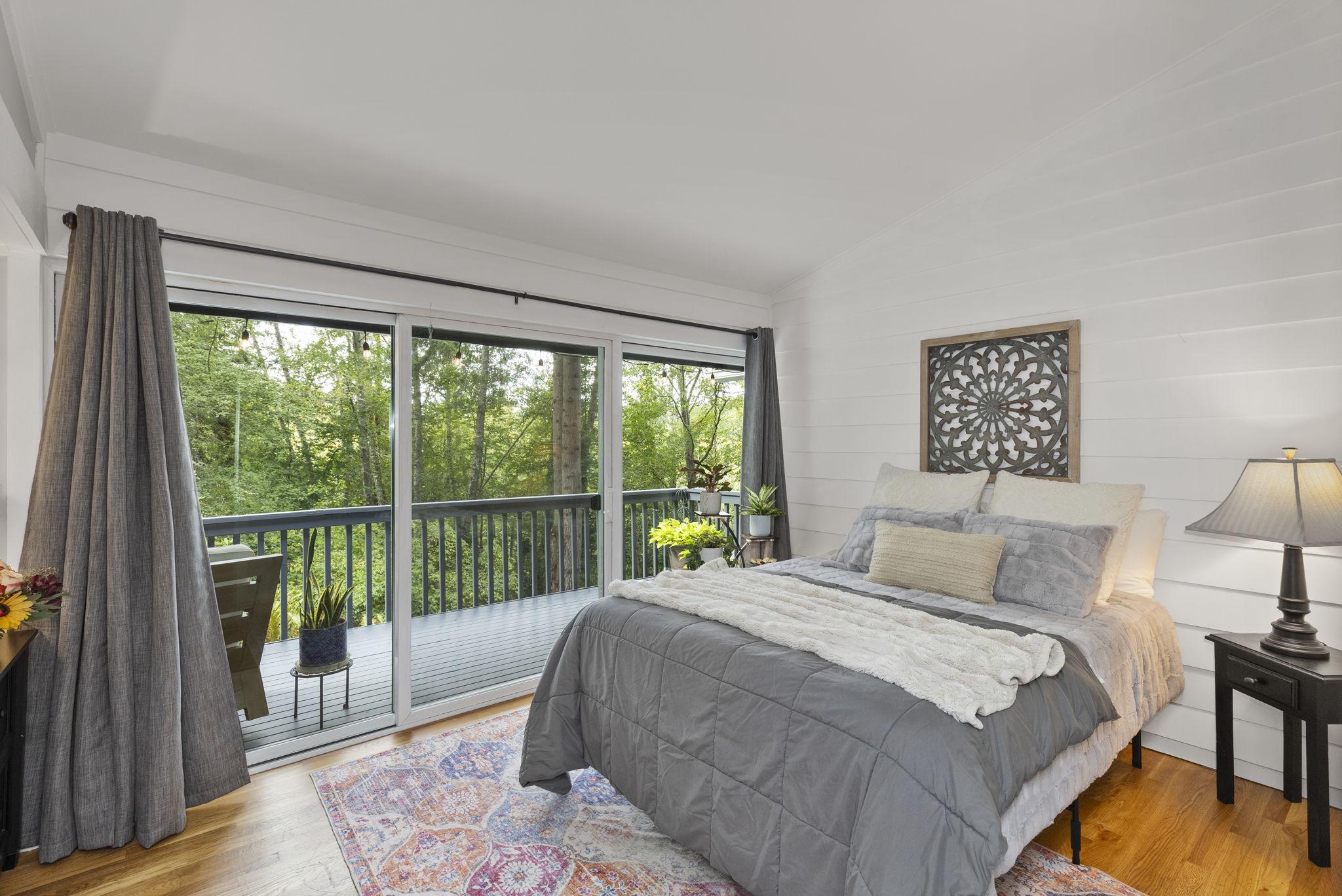 Comfortable second bedroom located on mainfloor with garden deck access