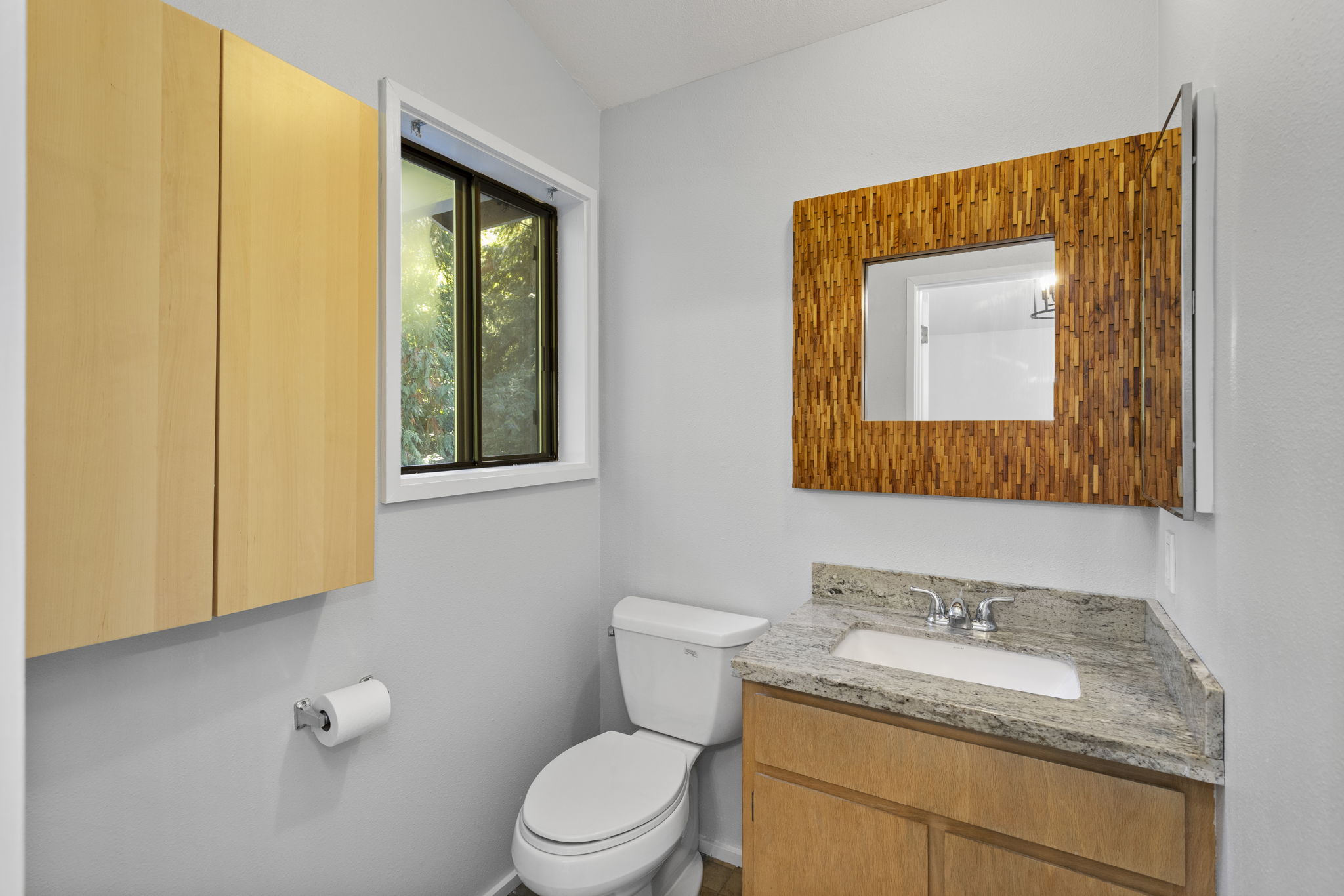 Functional half-bath attached to the upper level bedroom
