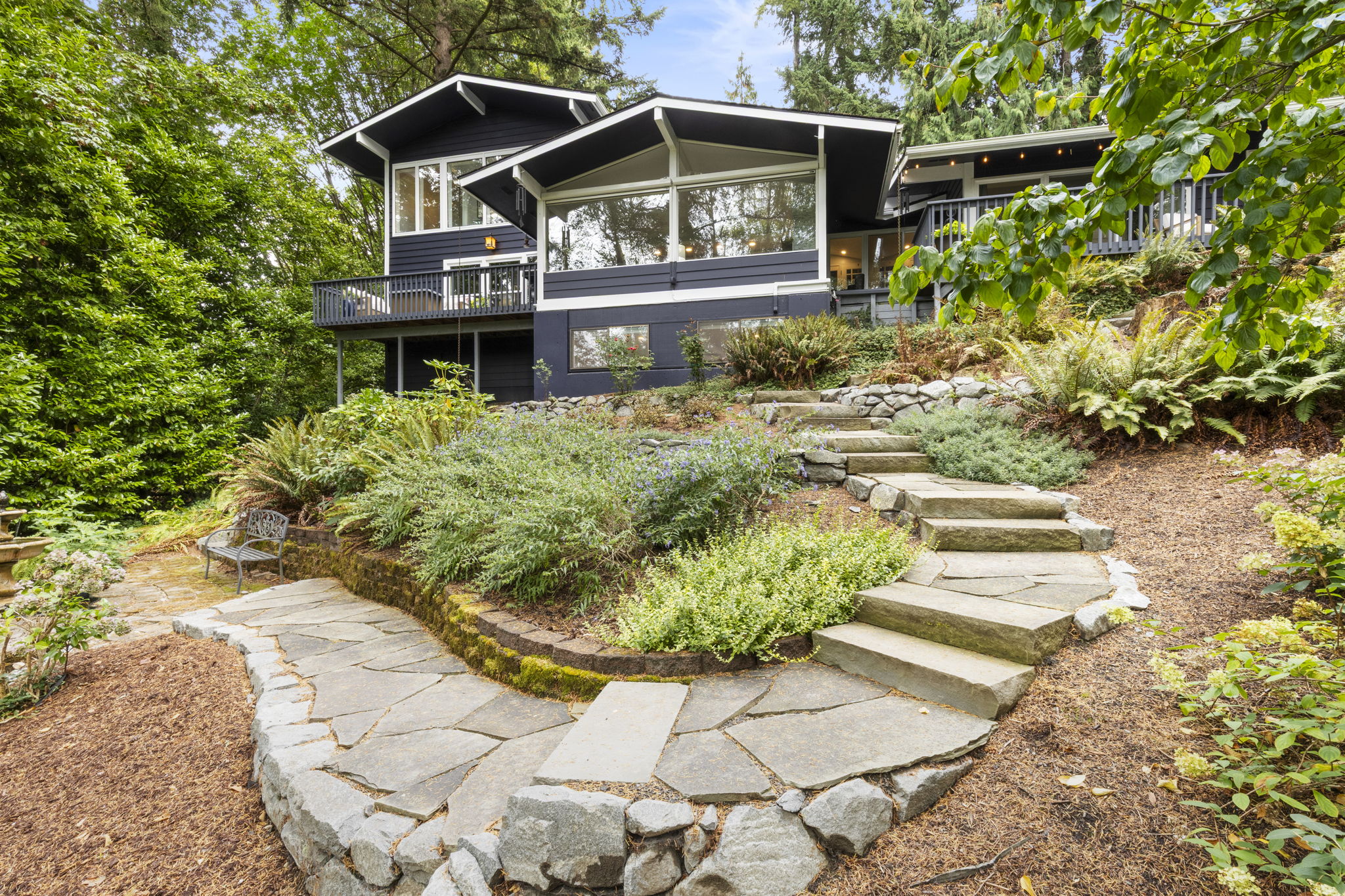 Stone path guiding you through landscaped gardens