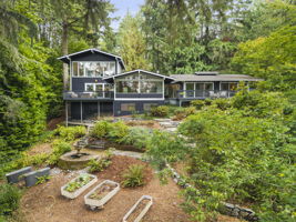 Rear of the house with charming garden beds.