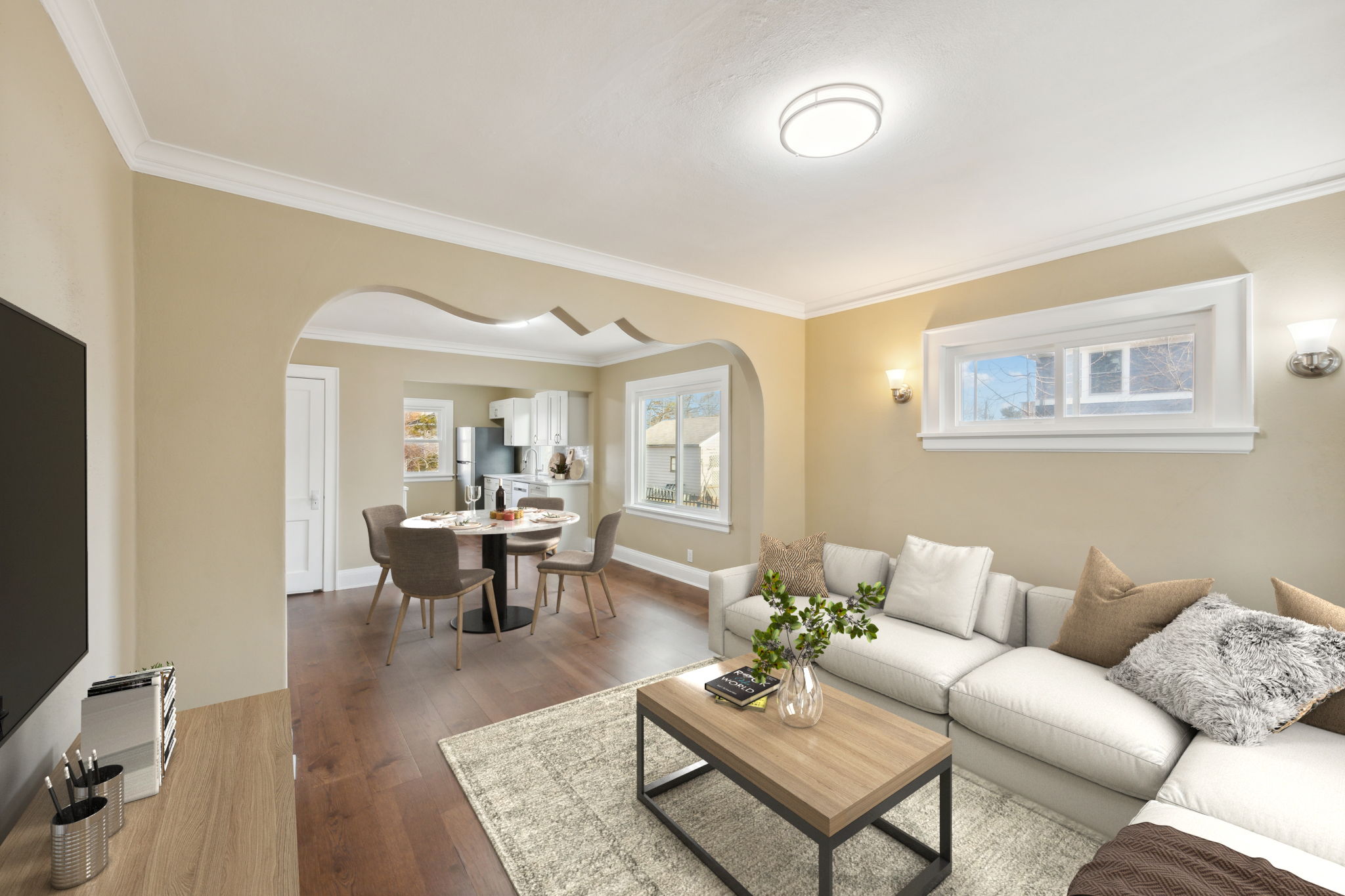 Natural light beams through all the windows, living room overlooking porch