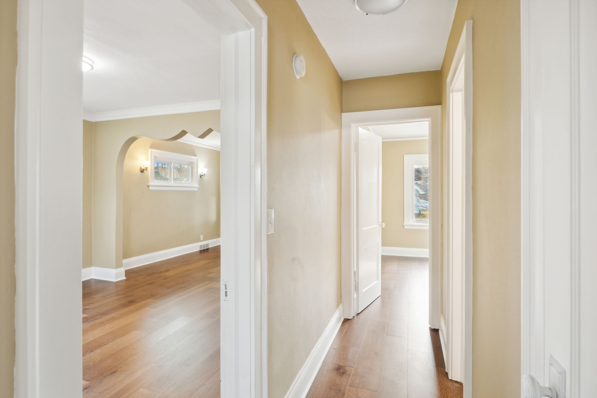See the natural light flowing through, hallway to the rooms and bath