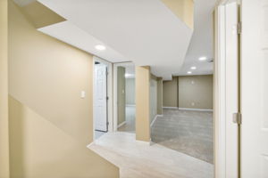 Entering the lower level with third bedroom, separate living area, and bath!