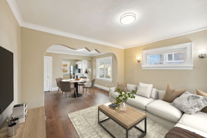Natural light beams through all the windows, living room overlooking porch