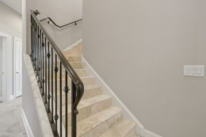 Wrought Iron & Travertine Staircase
