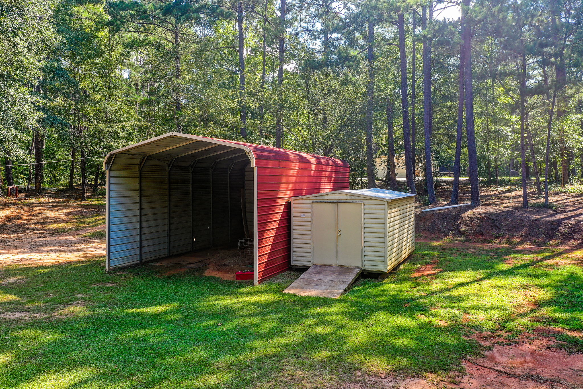 44 Aerial Large Vehicle Carport + Utility Shed