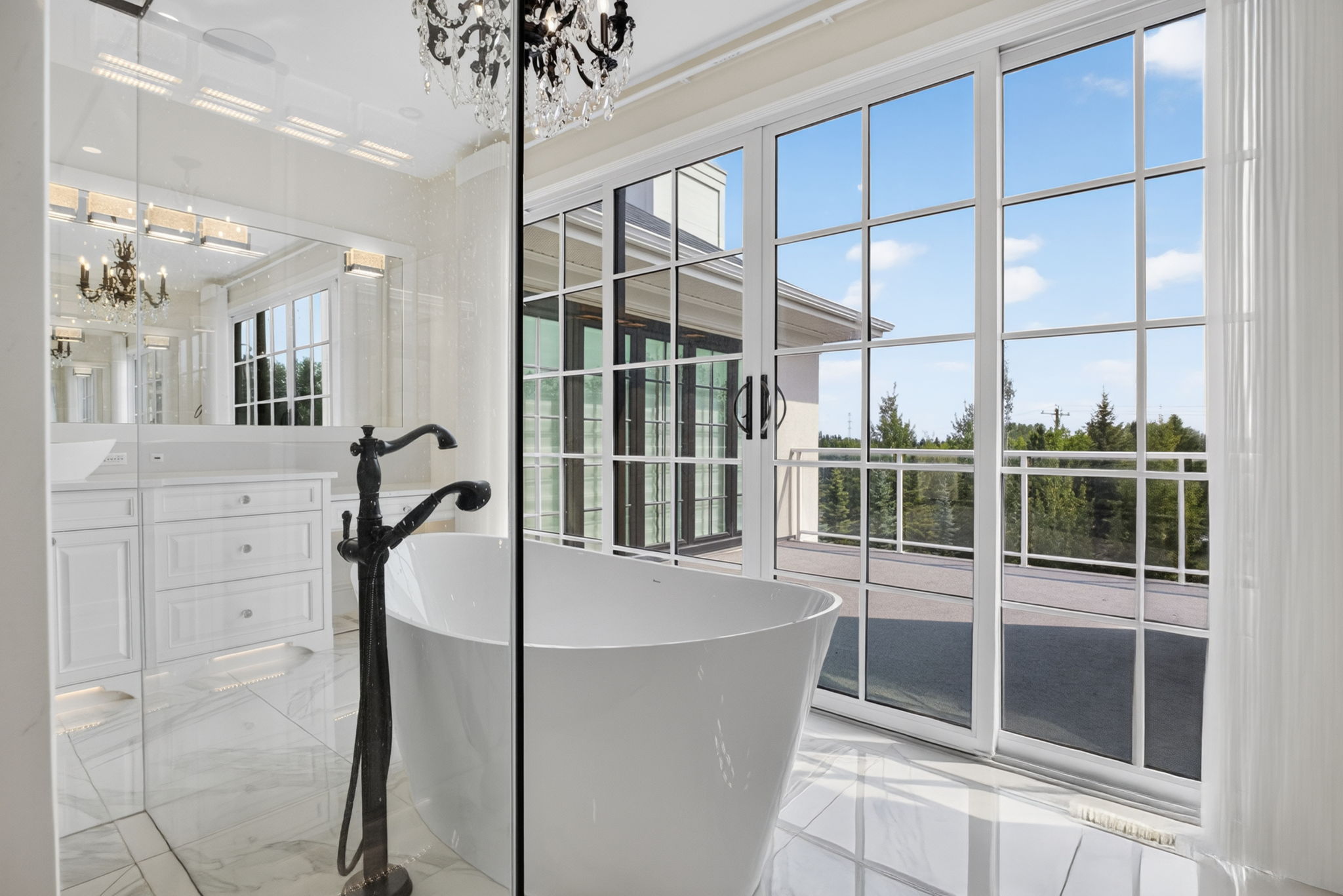 Spa-calibre ensuite with freestanding tub by the window