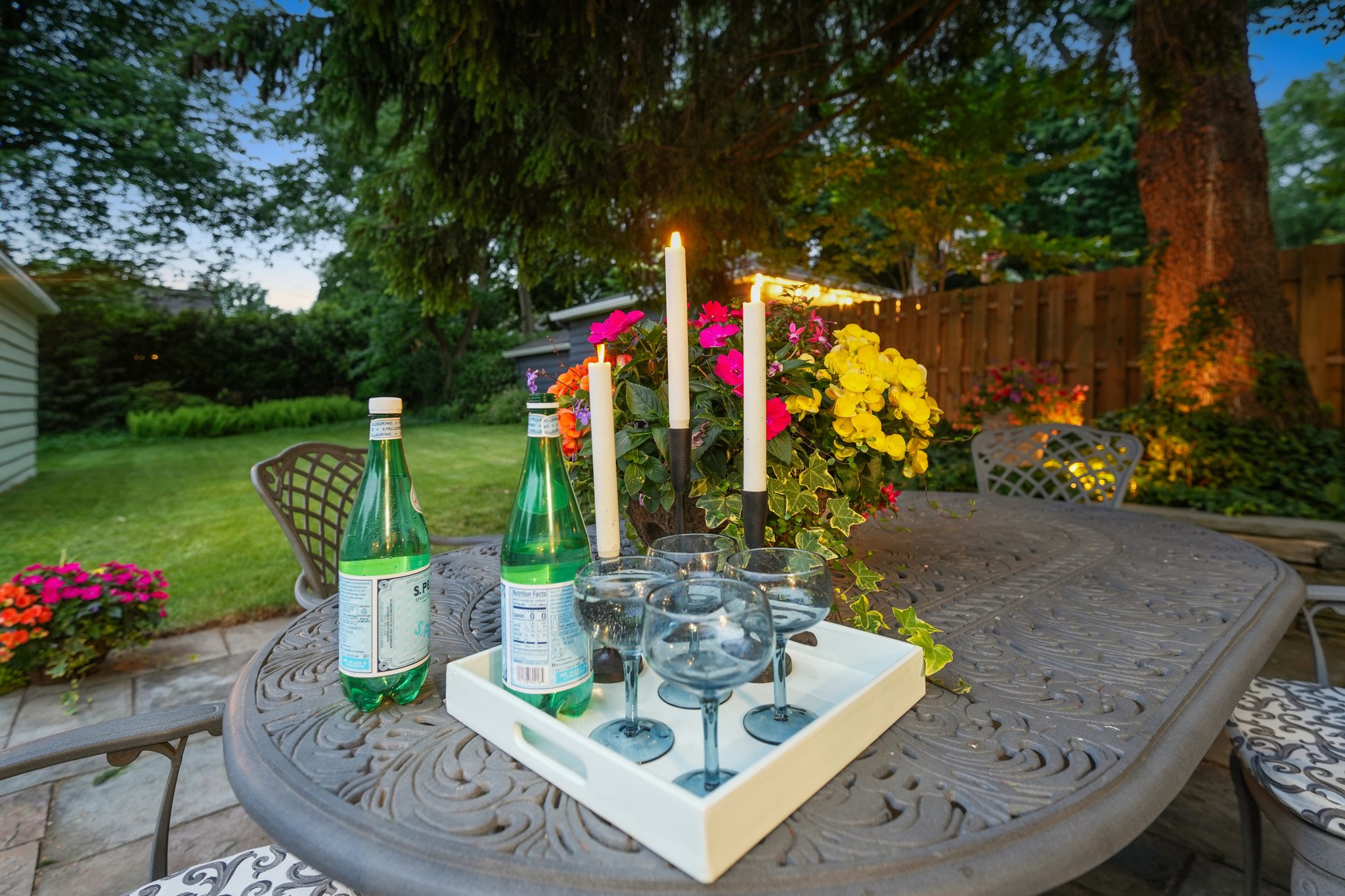 As the sun slips away and the candles are lit, the backyard takes on a little magic.