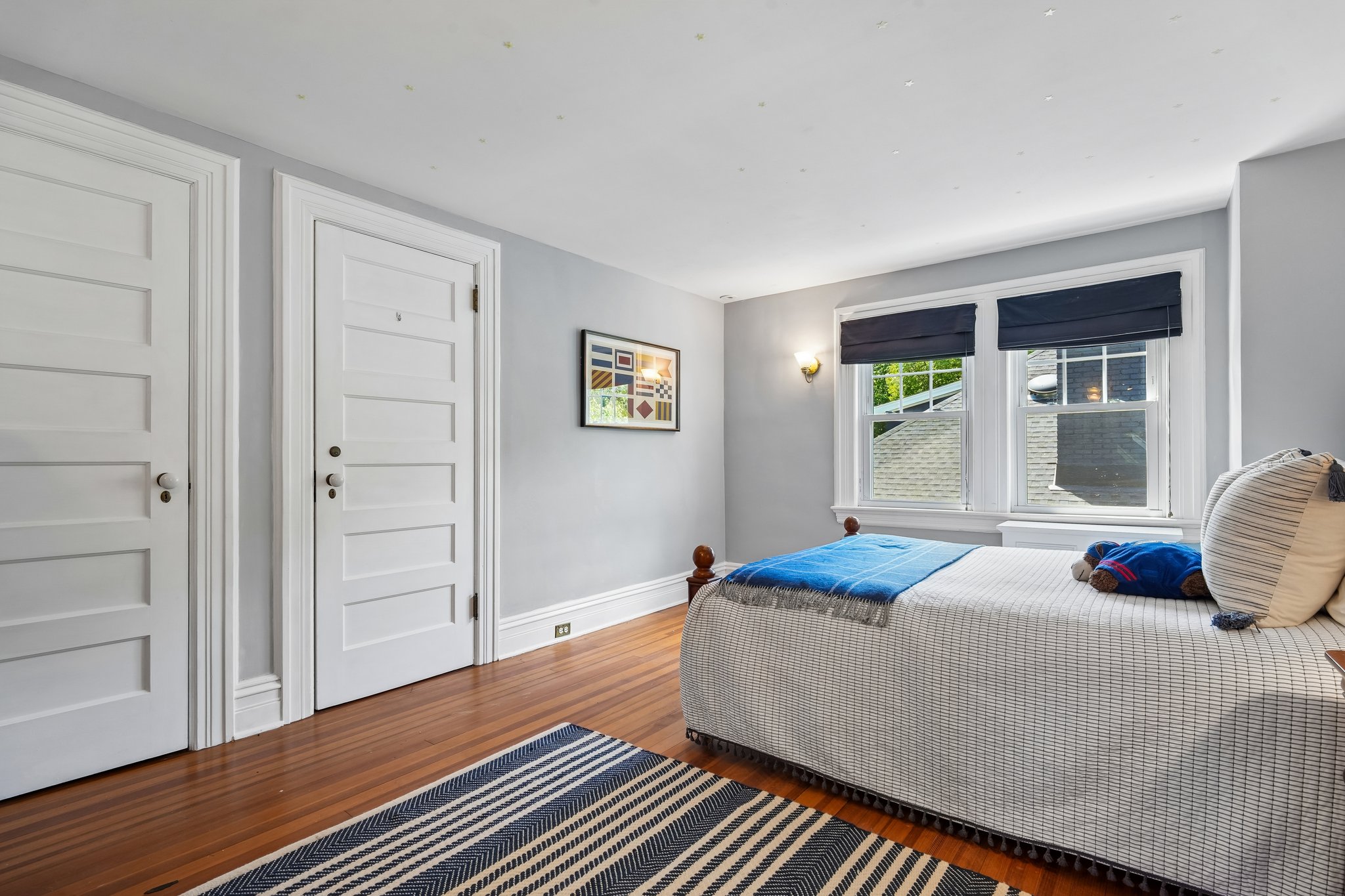 Bedroom 4 on the 3rd floor feels like its own little world. Tucked beneath the roofline, it's the kind of space children dream about and guests never want to leave. Abundant storage space up here too.