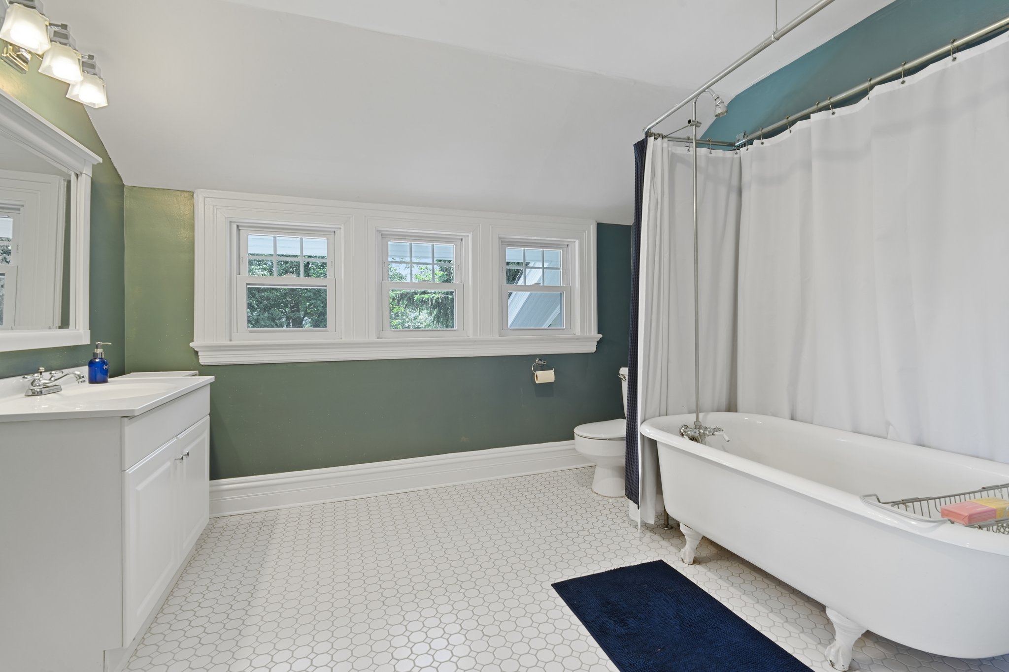 The 3rd floor bath boasts a classic clawfoot soaking tub invites long baths, deep exhalations, and the kind of quiet moments that turn an ordinary evening into something restorative.