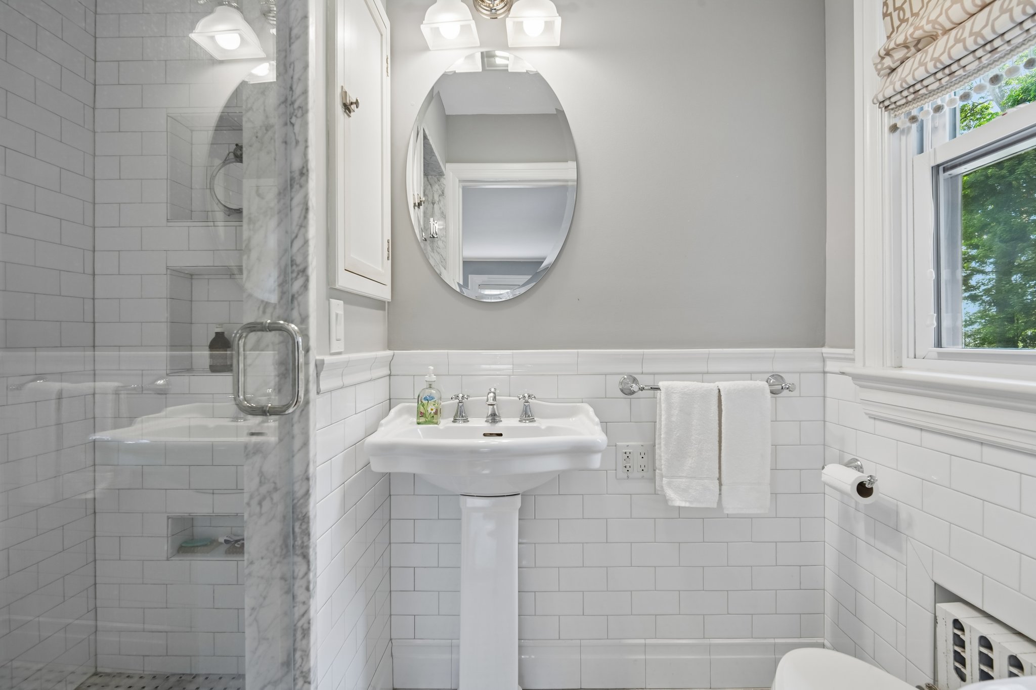 Beautifully updated with timeless finishes, the ensuite bath feels fresh, bright, and quietly luxurious - an everyday convenience that quickly becomes something you can't imagine living without.