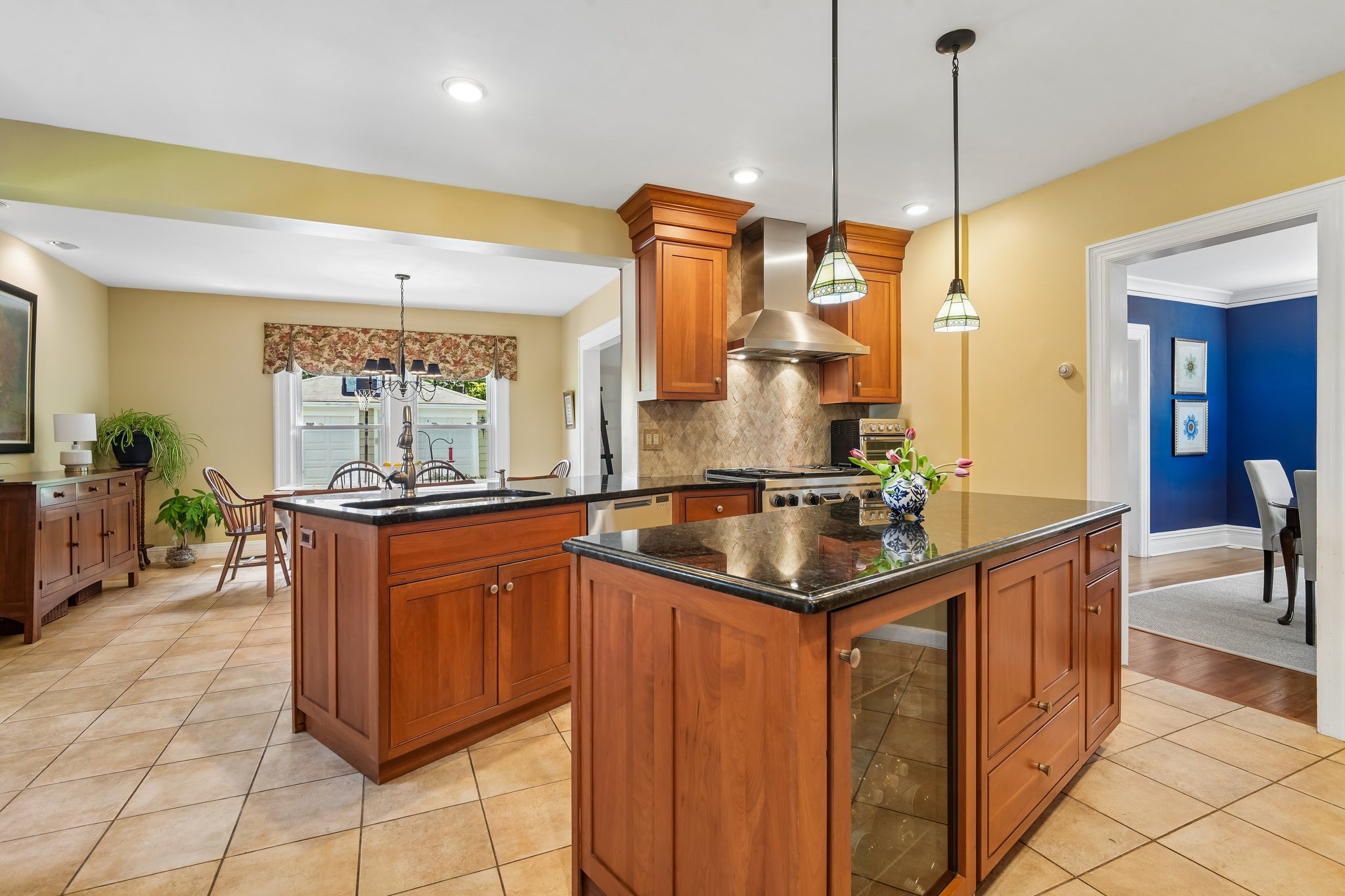 Designed for both cooking and gathering, the kitchen offers generous prep space, beautiful custom cabinetry, granite countertops, Wolfe range, Fisher Pakel dishwasher drawers, drinks fridge and an island that naturally becomes the center of attention. The first floor is incredibly connected. The dining room flows to the family room. The family room opens to the yard. The kitchen connects to everything.